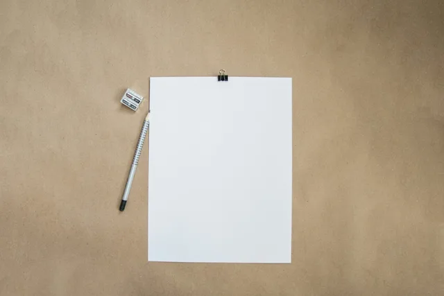 Blank paper with pencil and pencil sharpener